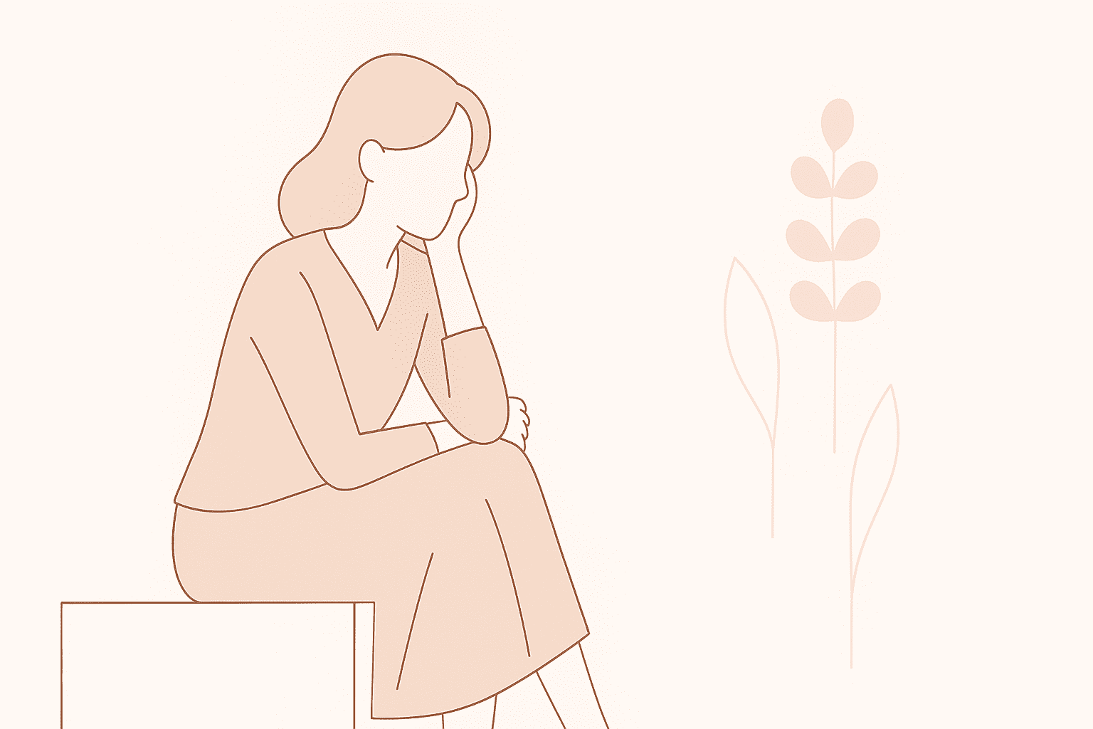 座って俯く女性
